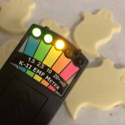 EMF Reader with lights on behind white chocolate ghosts