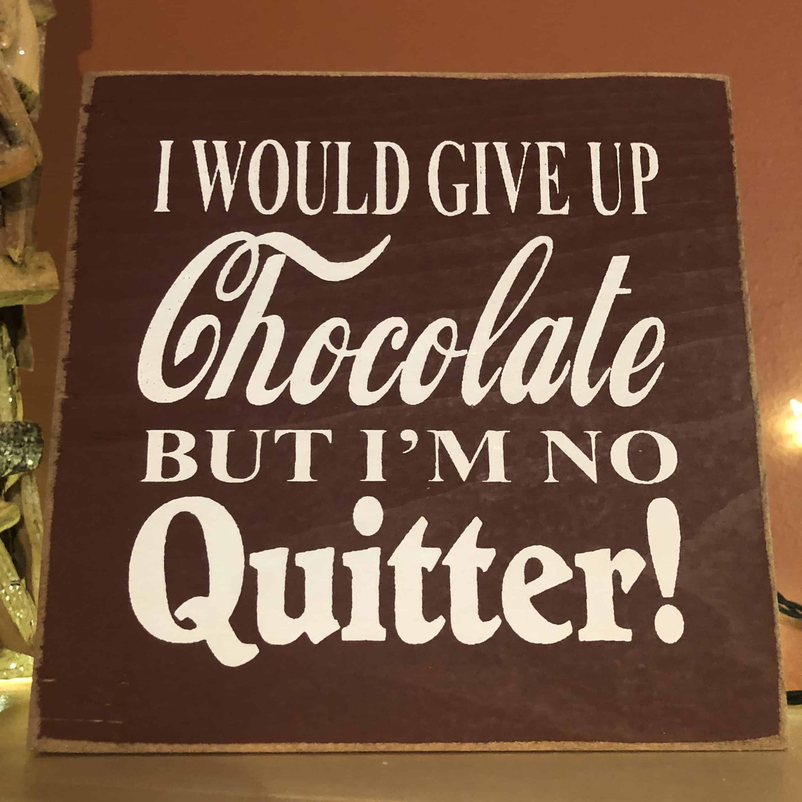 wooden sign with i would give up chocolate but I'm no quitter