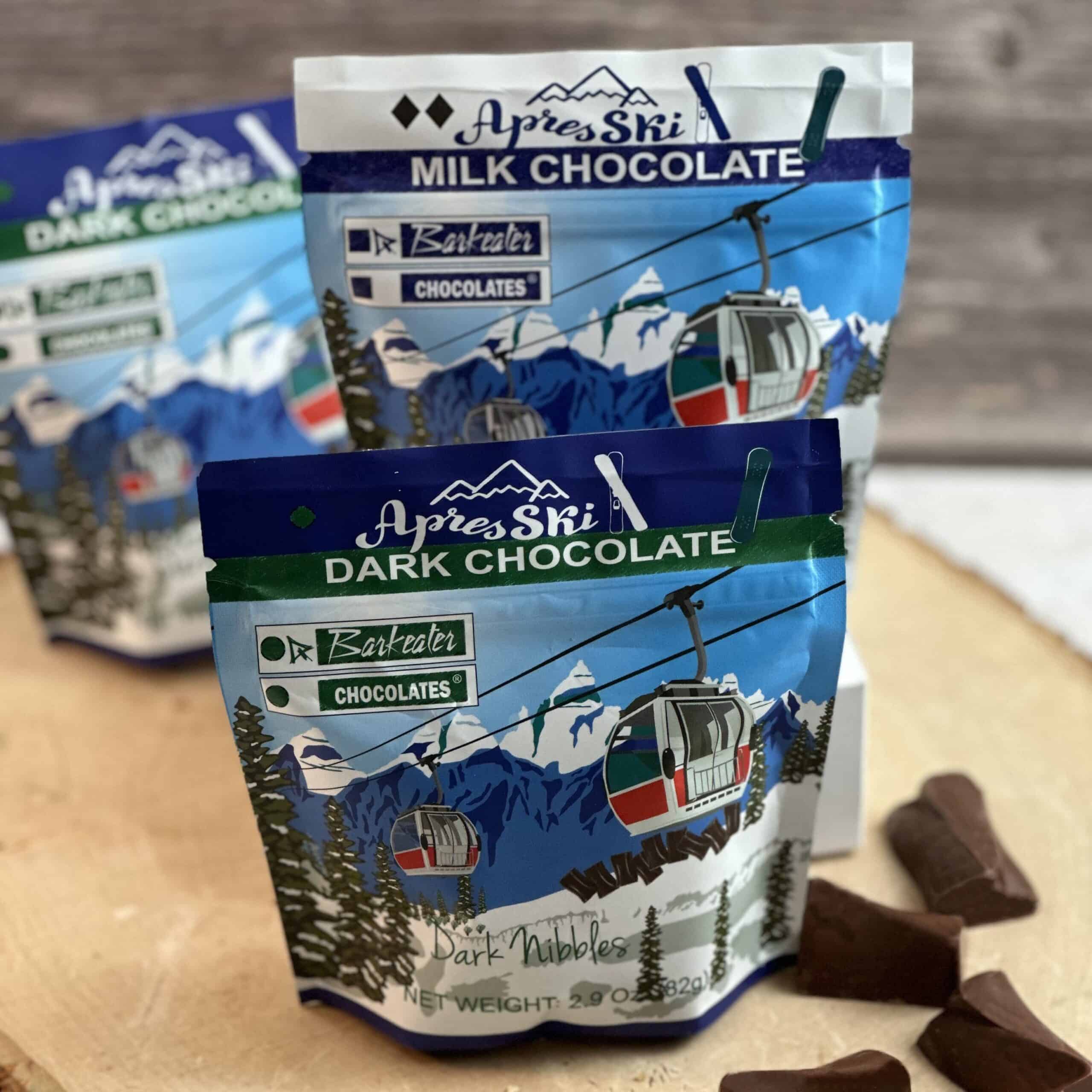 unpackaged chocolate chunks with pouches of chocolate ski design on bags