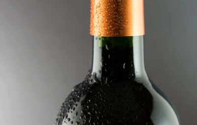 close up of the neck of a wine bottle, chilled with condensation