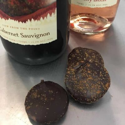 Bottle of Adirondack Winery wine with chocolate caramels